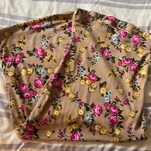 Tan like color base with a floral pattern